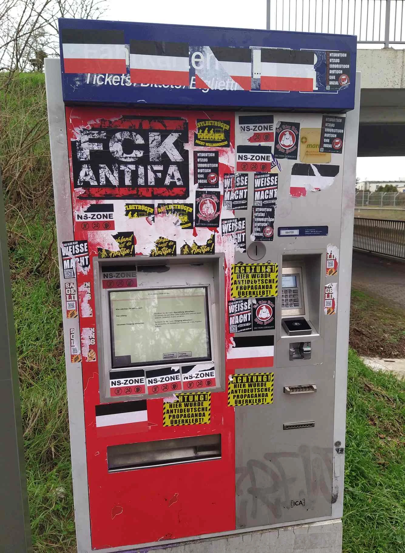 Ticket machine covered in faschist stickers