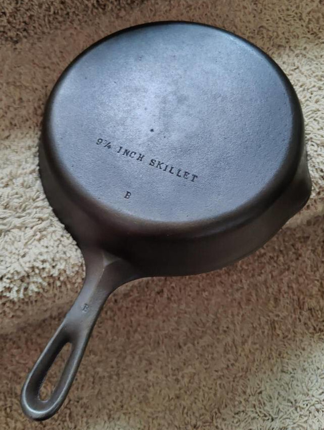 9-inch skillet, bottom side, reading "9 3/4 inch skillet"