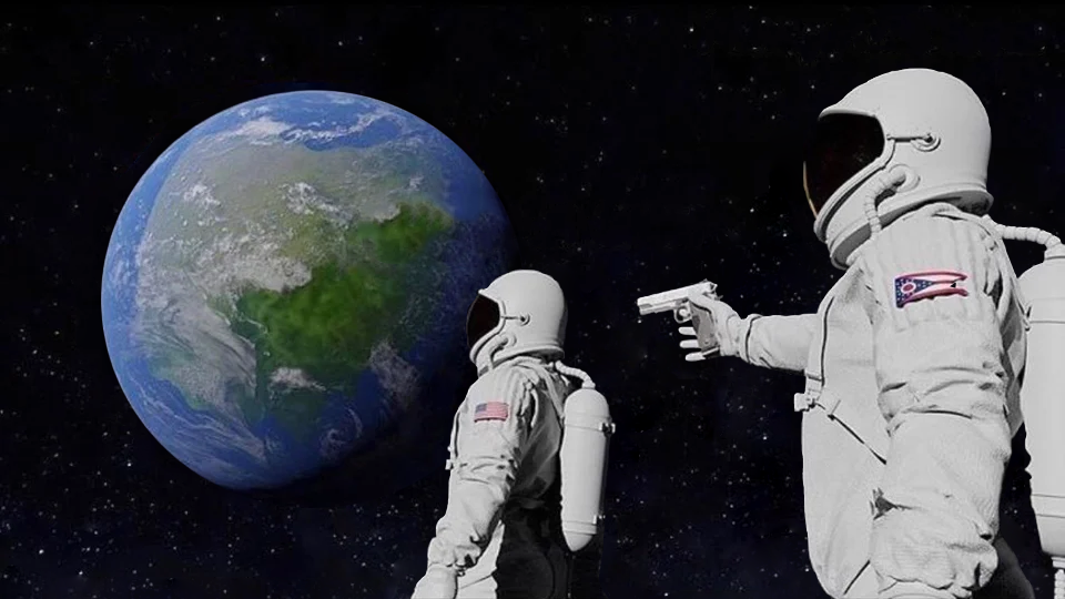 Image of two astronauts facing the earth from a distant place. The one in the background doesn’t know rhe one in the foreground is pointing a gun at him. Aka the “it always has been” meme.